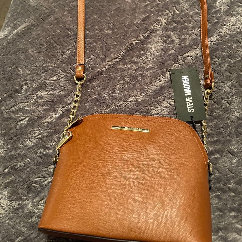 Brand new, brown Steve Madden purse with tags on.